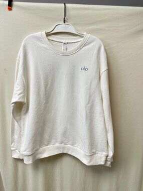 The white sweatshirt by ALO is in slightly different color in the photo; it is p